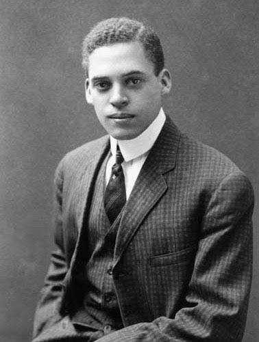 Formal portrait of a young Ernest Everett Just in a suit and tie